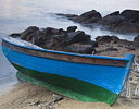 Wooden boat pulled onto sand, Mykonos Greek Isles