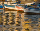 Evening light on colorful fishing boats  harbor of Kusadasi Turkish Aegean