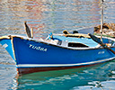 Lone fishing boat in harbor Kusadasi, Turkey